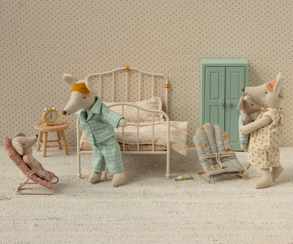 Soft toy mouse family in bedroom setup with a bed, wardrobe and babysitters