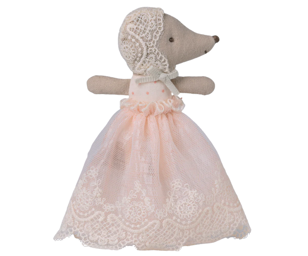 Toy baby mouse in a lace dress and bonnet on a white background