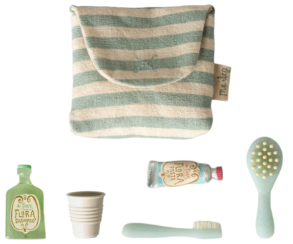 Set of Maileg mice accessories including a striped pouch, bottle, cup, tube, and brush on a white background.