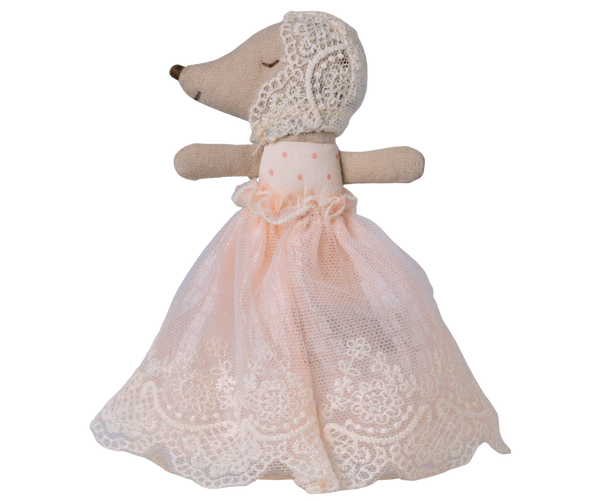 Stuffed baby mouse toy with a lace dress on a white background