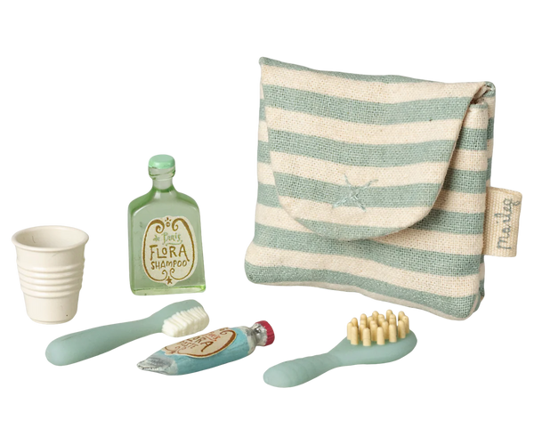 Set of Maileg toy mouse dental care items including a cup, toothbrush, and toothpaste with a striped pouch on a white background.