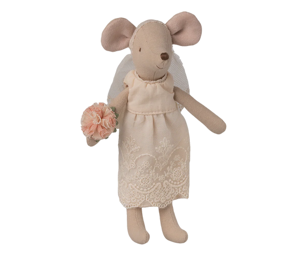 Stuffed mouse toy in a dress holding a bouquet on a white background