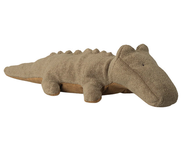 Plush toy crocodile on a white background
