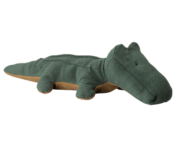 Green plush toy crocodile on a white background