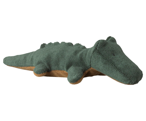 Green crocodile toy on a white background