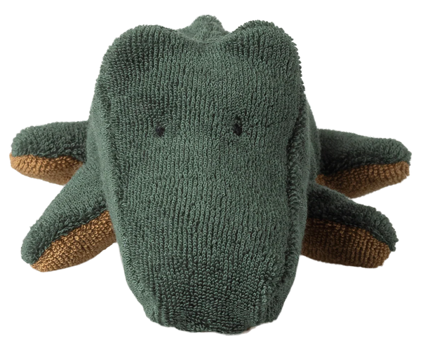 Knitted toy crocodile on a white background