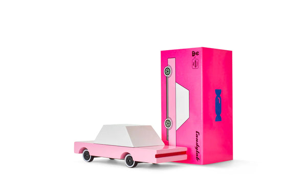 Pink toy car and packaging on a white background
