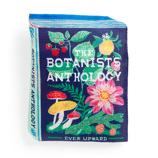 Bag folded into a bag with 'The Botanist's Anthology' text and botanical illustrations on a white background