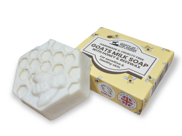 Goats milk soap with a yellow box on a white background