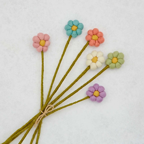 Bouquet of colourful fabric flowers on a white background