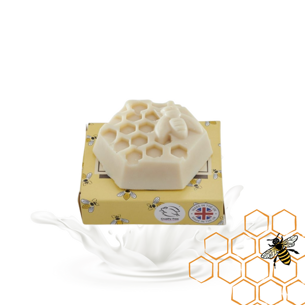 Beeswax and goats milk soap in a honeycomb design on a white background