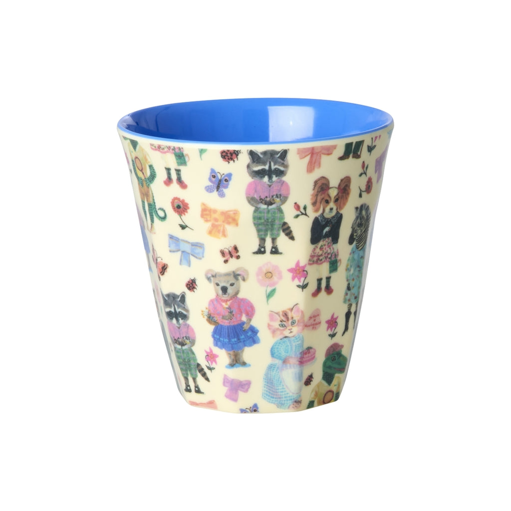 Cup with animal pattern and blue interior on a white background