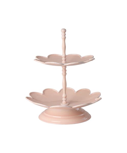 Two-tiered pink ceramic cake stand on a white background