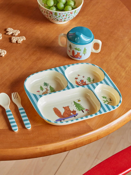 Children's tableware set with a tray, cup, and cutlery on a wooden table.