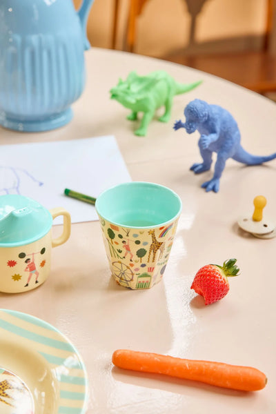 Mint Fun Fair Cup on a table with toys and food