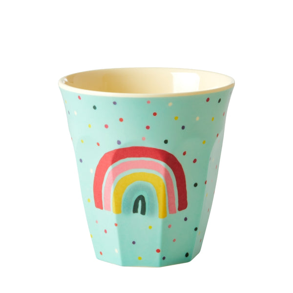 Children's cup with rainbow design on a white background