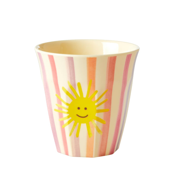 Children's cup with sun design and striped pattern on a white background