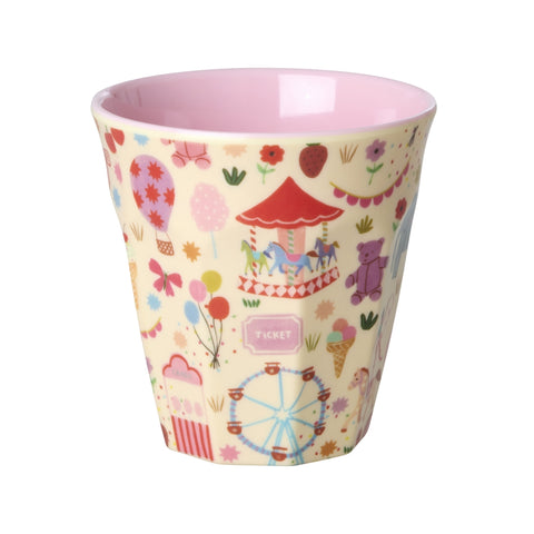 Children's cup with colourful pattern on a white background