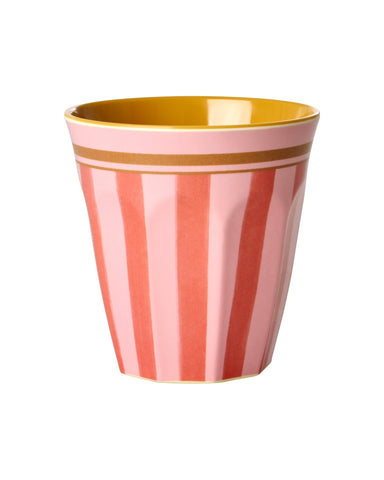 Pink and gold striped cup on a white background