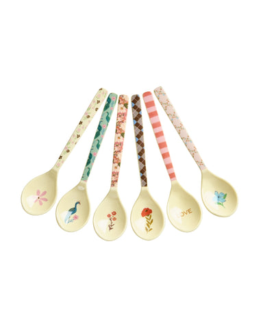 Set of decorative spoons with floral and nature-themed designs on a white background