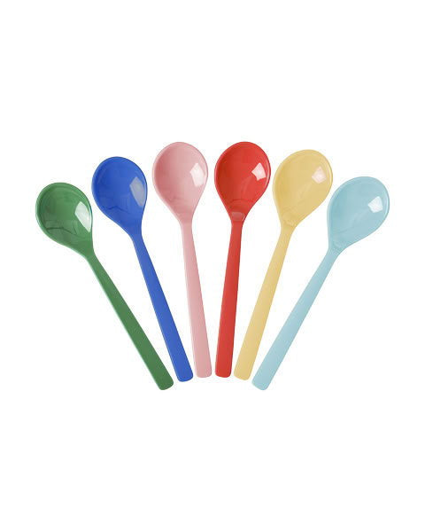 Set of six colourful spoons on a white background