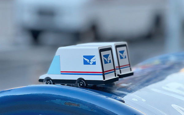 Model of a postal truck with U.S. Postal Service logo