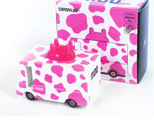 Toy car with pink cow print design on a white background