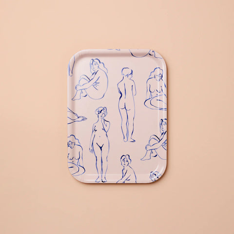 Rectangular tray featuring blue line art women against a blush background