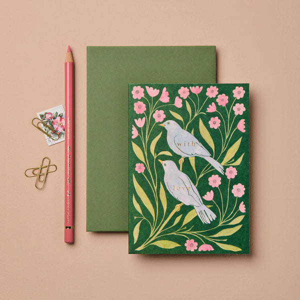 Green card with bird and floral design on a beige background