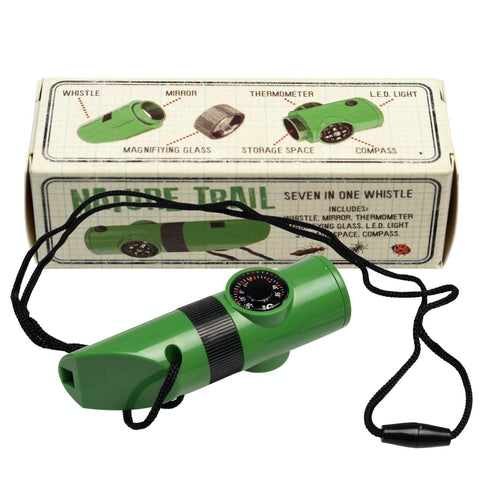 Green whistle with black strap in front of its packaging box on a white background