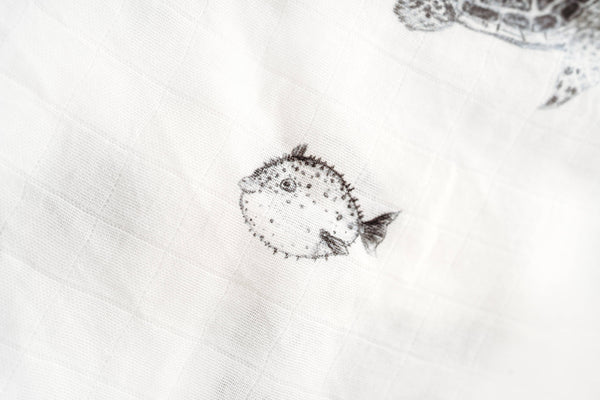 Black and white illustration of a fish on a textured white background