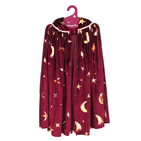 Red cape with gold star and moon patterns on a hanger against a white background