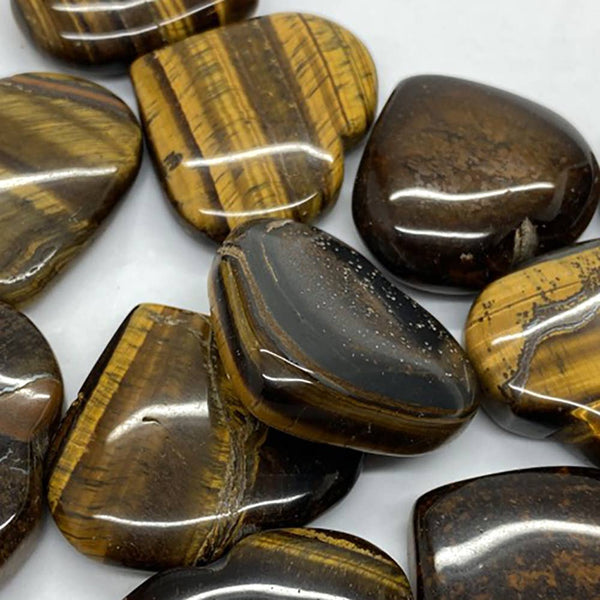 Collection of tiger eye stones on a white background
