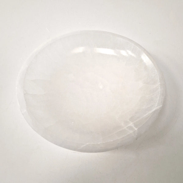 White crystal bowl on a light grey background