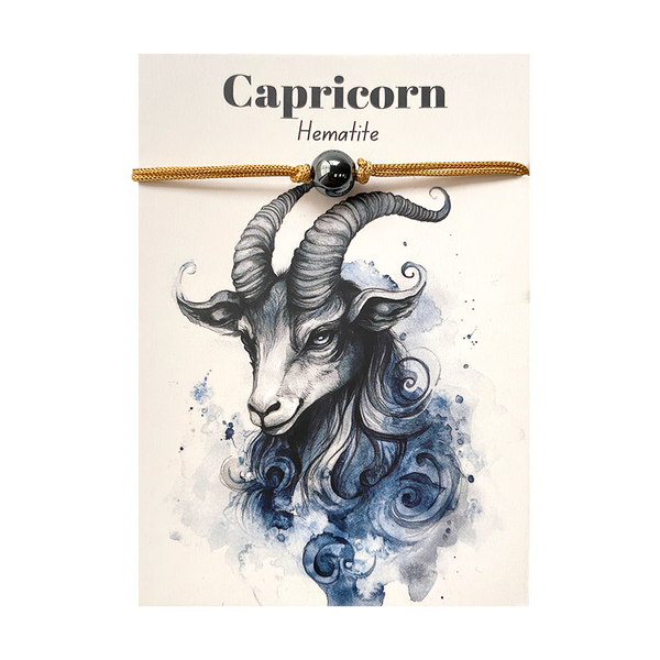 Capricorn zodiac sign hematite bracelet with goat illustration on a card