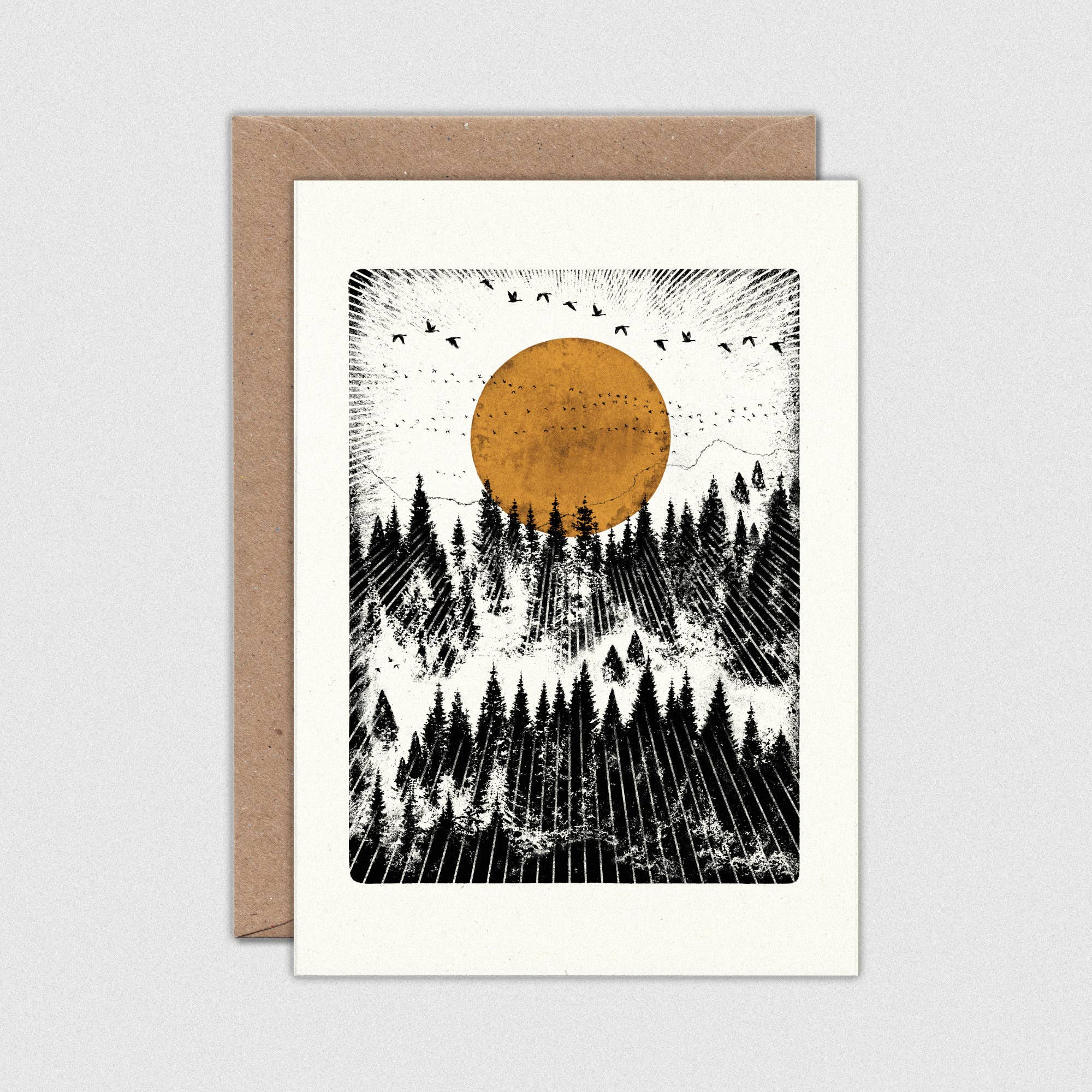 Greeting card with a stylized illustration of a forest and sun, featuring a brown circle on a white background.