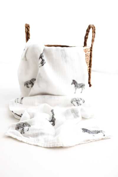White fabric with black animal prints on a white background