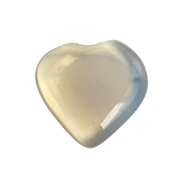 Heart-shaped opalite crystal on a white background
