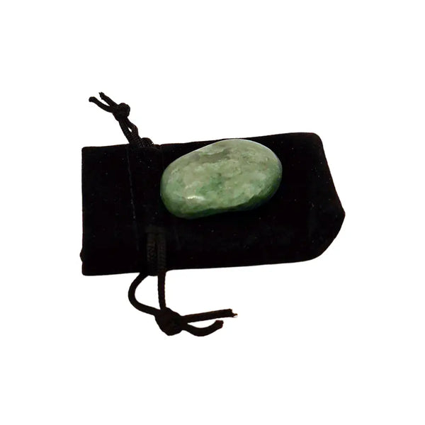Green stone on a black drawstring pouch against a white background