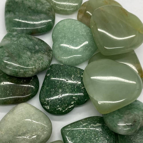 Collection of green aventrine stones on a white background