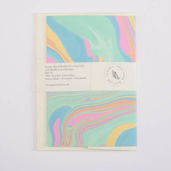 Pastel marbled design on a greeting card with text and branding.