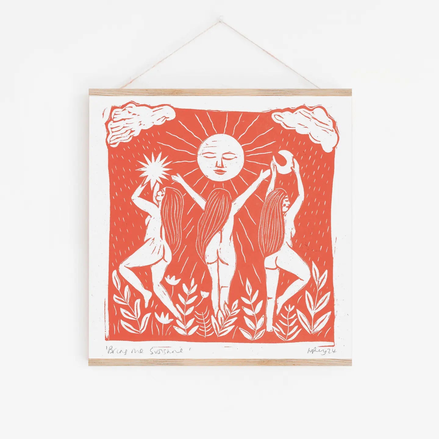 Framed artwork with a red background and white figures and sun design.