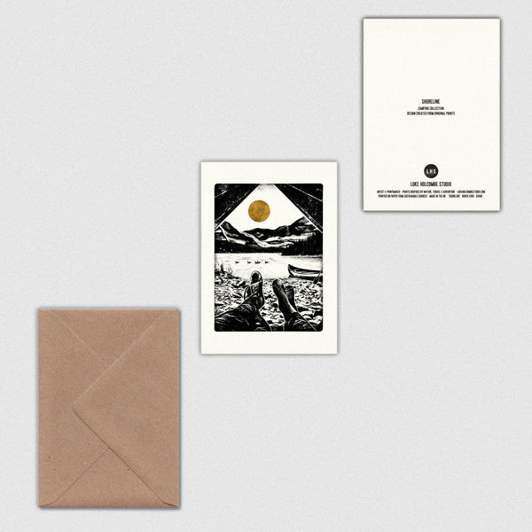 Front and back of a greeting card featuring a print of a mountain scene with a brown envelope on a light grey background.