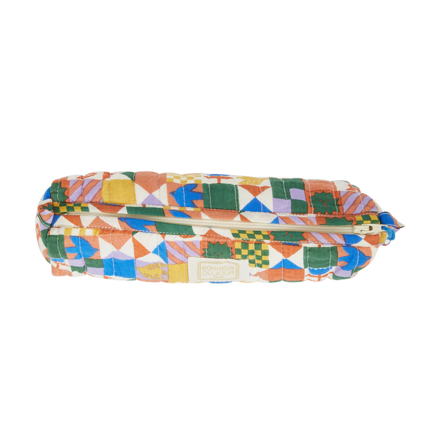 Colourful quilted pencil case on a white background