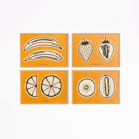 Set of four orange cards with black and white illustrations of fruits on a white background.