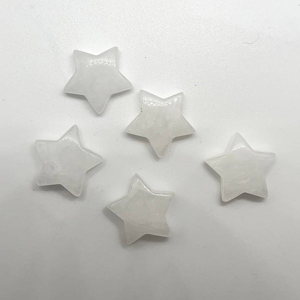 Five star-shaped gemstones on a white background