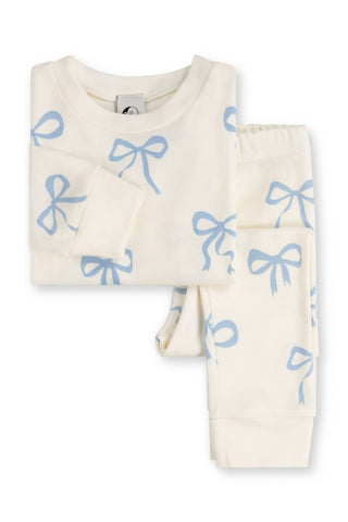 Children's pyjama set with blue bow pattern on a white background