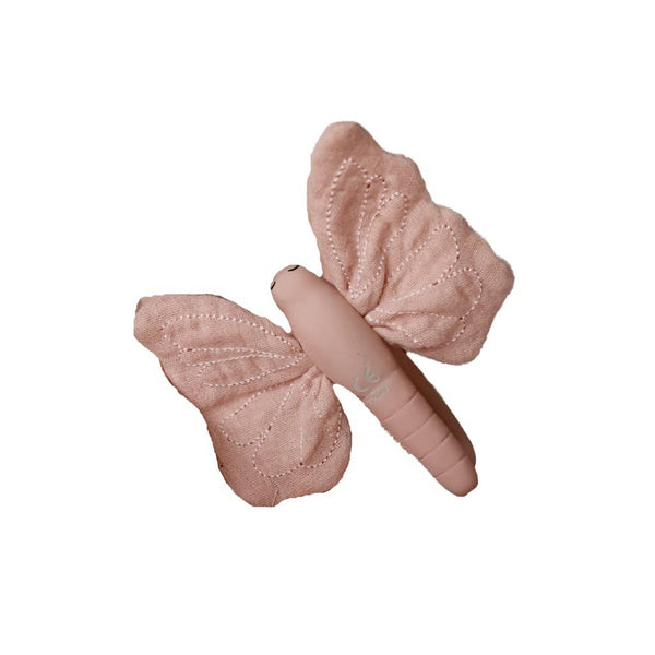 Pink butterfly-shaped baby teether on a white background