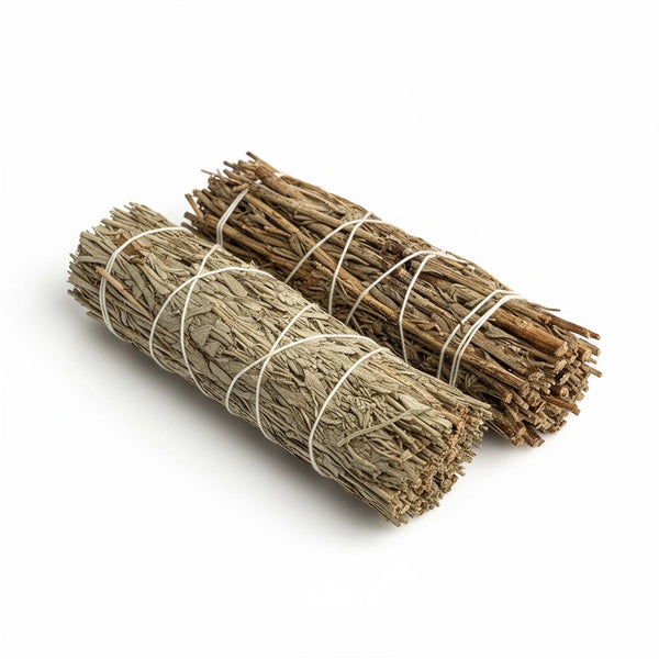 Two bundles of sage tied together on a white background