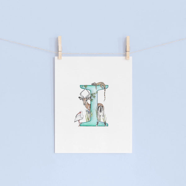 Decorative letter 'I' with illustrations of animals on a light blue background.